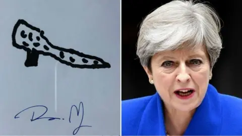 Getty Images Theresa May and her drawing