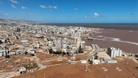 Getty Images Aerial view of Derna and destruction caused by floodwaters after dams burst