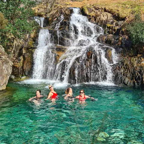 Emma Marshall Four women in a mountain pool