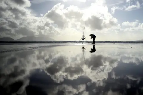 Clodagh Kilcoyne/ Reuters A man participates in the Diawa Irish Pairs sea angling event
