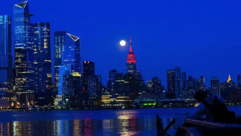 Reuters The Supermoon rises behind the Empire State Building - 7 April 2020