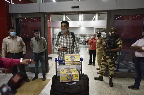 Getty Images Passengers from Kabul arrive at T3 Indira Gandhi International Airport, on August 15, 2021 in New Delhi, India.