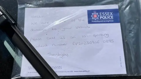 Richard Daniel/BBC Note from police left on a damaged car