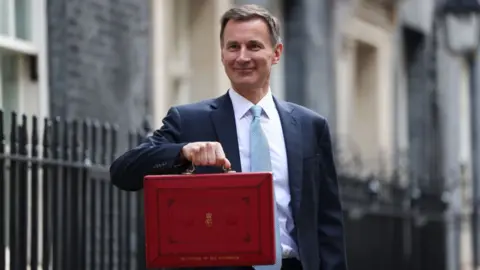 Getty Images Jeremy Hunt made the windfall tax announcement in his Budget on Wednesday