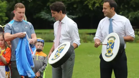 PA/Niall Carson Justin Trudeau plays a boron along with Leo Varadkar