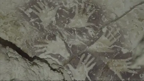 Hand stencils found in the cave dating back over 37,000 years