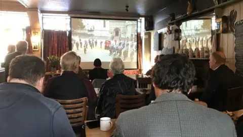 People watching television in the Alma Inn, Harwich