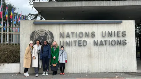 Yasmin Marchant People outside UN sign in Geneva