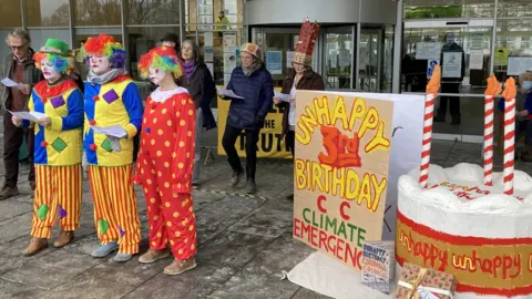BBC Protestors dressed as clowns