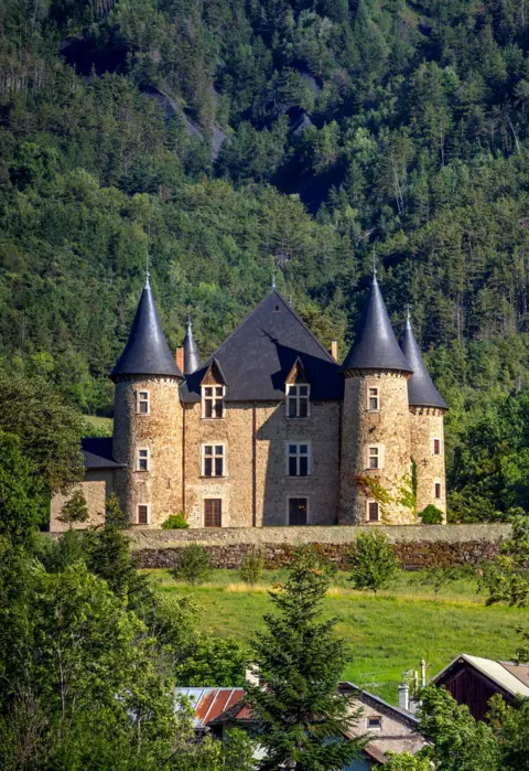 Alamy Picomtal Castle and mountain forest