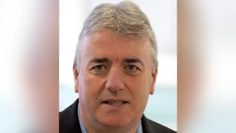 Content Creators Blackpool Steve Richardson has thick short grey hair.