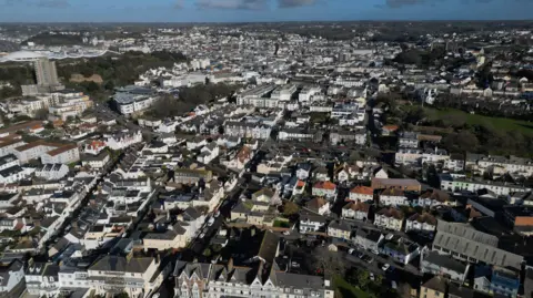 BBC South St Helier, Jersey. A view of a housing district of the island with sprawling houses and flats. 