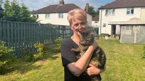 Tony Fisher/BBC Marina with her cat