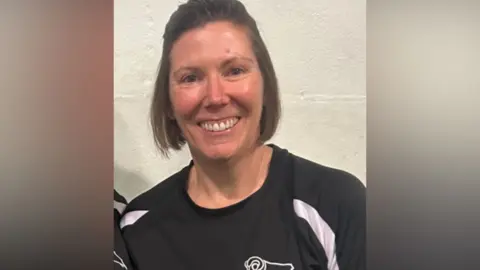 A woman in a Derby FC training top