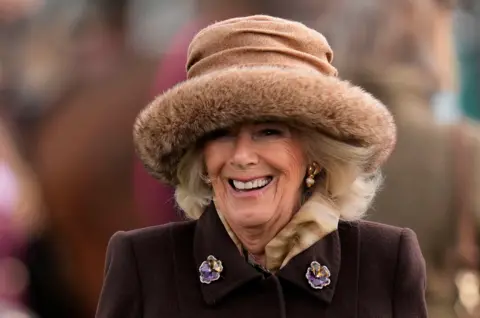 Queen Camilla in the parade ring on day two of the 2025 Cheltenham Festival at Cheltenham Racecourse