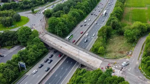 National Highways A drone shot of the A432 bridge showing it closed and with no tarmac on the road section.