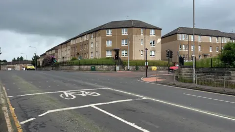 view over a four-lane road to several blocks of flats
