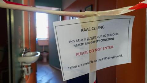 A sign at Parks Primary School in Leicester asking people not to enter the toilets because of Raac