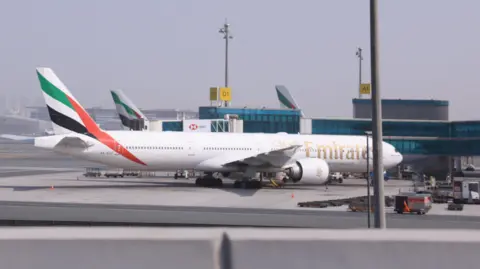 Reuters Planes are parked at Terminal 3 of the Dubai International Airport, following the United States and Israel strikes on Iran, in Dubai, United Arab Emirates, March 2, 2026.