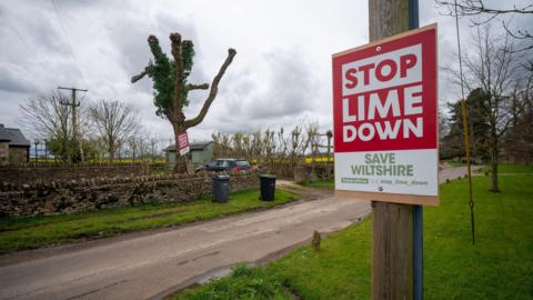 Anti solar farm signs in village