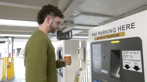 bbc Man buys car parking ticket
