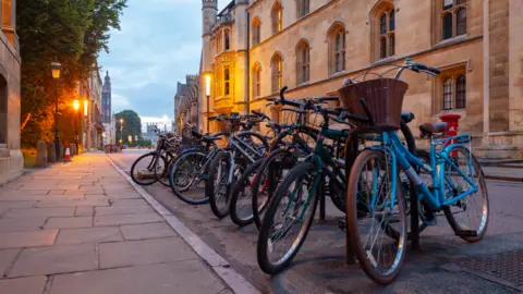 Getty Images Cambridge city centre showing a row of parked pedal bikes