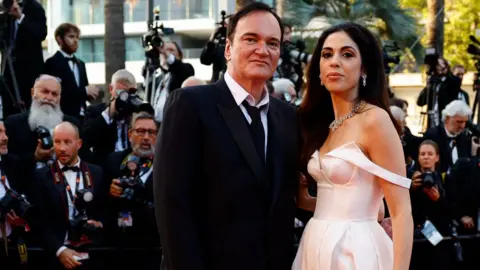 Reuters Quentin Tarantino and his wife Daniella Pick pose on the red carpet to attend the closing ceremony and the screening of the animated film "Elemental" Out of competition, during the 76th Cannes Film Festival in Cannes, France, May 27, 2023. 
