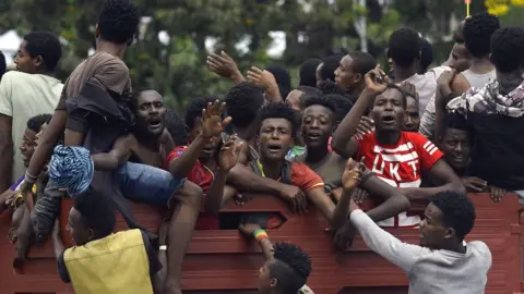 Getty Images Young people riding around in a truck following plans to declare a breakaway region