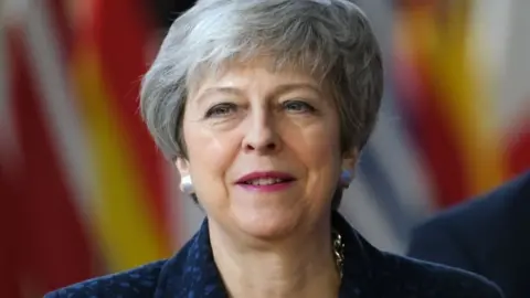 Getty Images Theresa May arriving in Brussels