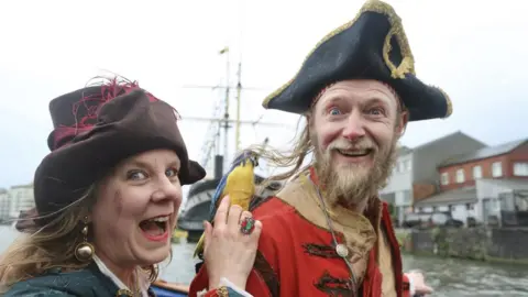 Show of Strength Street performers dressed as pirates on the streets around Bristol's Harbourside