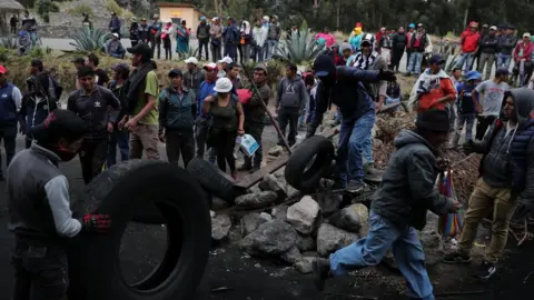 Reuters protesters block a road in Cangahua