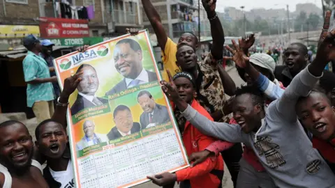 AFP Image shows supporters of opposition candidate Raila Odinga celebrating in the street