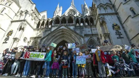 School children from Yerbury Primary School protest outside the High Court