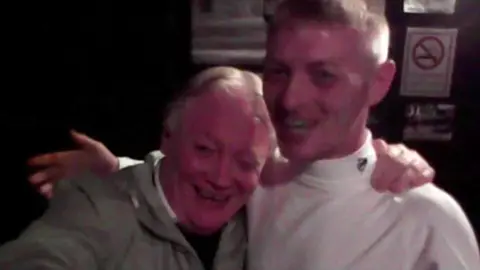 Handout John McGarrigle with his son