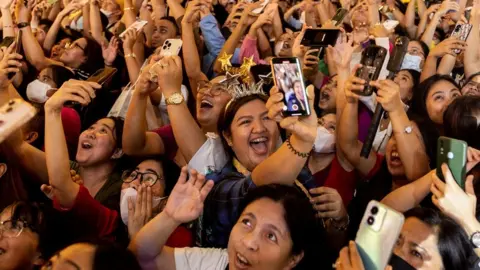 Reuters Revellers celebrate during a New Year's Eve party in Quezon City, Metro Manila, Philippines,