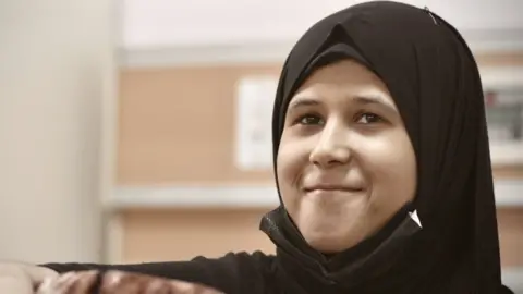 Jess Kelly/BBC News Fatima, 13, in hospital whilst receiving treatment for Leukaemia