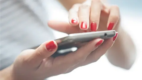 Zhenikeyev Person using phone