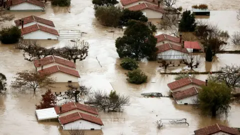 EPA An aerial view taken with a drone shows flooded area of Huarte in Navarra, Spain, 10 December 2021, where River Arga has overflown due to the heavy rains registered during the last days