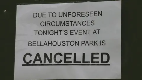 Sign: Due to unforeseen circumstances tonight's event at Bellahouston Park is cancelled