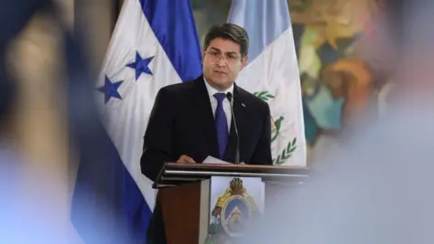 Reuters Honduras President Juan Orlando Hernandez speaks during a news conference with Guatemala's President Jimmy Morales (unseen), for the situation of the large caravan of Central American migrants trying to reach the United States, in Tegucigalpa, Honduras November 5, 2018.