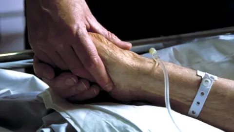 Science Photo Library hands holding