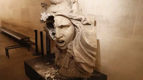 EPA Vandalised statue of Marianne inside the Arc de Triomphe - 1 December