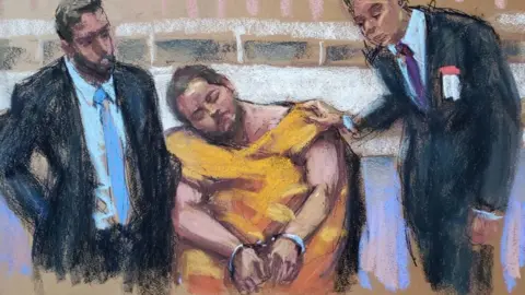 Reuters The suspect appeared in court looking beaten