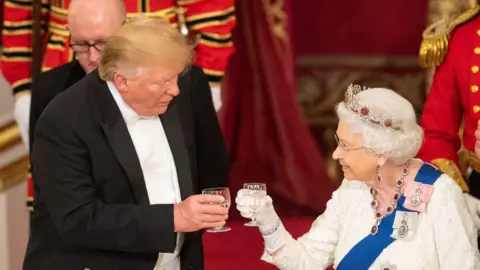 Getty Images Donald Trump and the Queen make toast