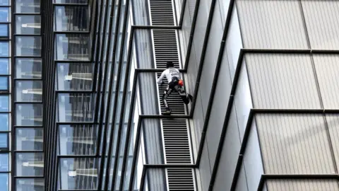 Reuters Alain Robert climbing the Heron Tower