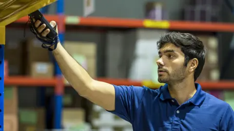 Getty Images Man working in warehouse