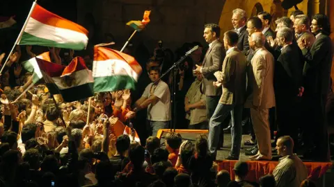 AFP Viktor Orban (C), leader of the largest Hungarian opposition party, Fidesz, addresses a press conference after the party lost the parliamentary elections in Budapest 23 April 2006