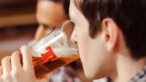 Tennent's A man drinking Tennent's