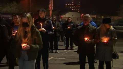 BBC People gathered for a candlelit vigil