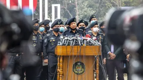 EPA The Rapid Action Battalion marking "Martyrs' Day" in Dhaka on 20 Feb 2021